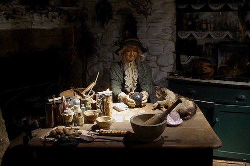 A diorama of a cunning woman in the Museum of Witchcraft and Magic, Boscastle, Cornwall