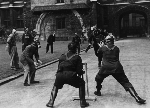 Public Record Office staff play cricket outside Chancery Lane offices during the Blitz.