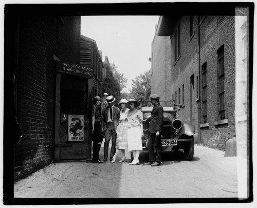 Friends at the entrance of illegal speakeasy, The Krazy Kat. July 1921.