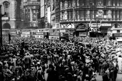 Revelers pictured in Piccadilly Square on May 8th, 1945. 